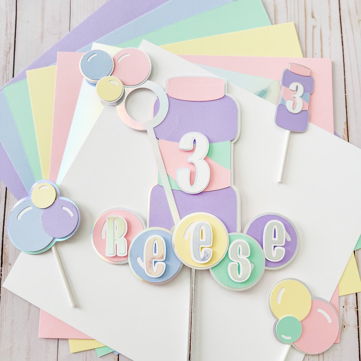 CardstockWH's tweet photo. You all loved Melissa's bubble party favor tags so much that we thought we’d share the matching cake topper with you! 🫧☀️ Created using our Pastel Dreams multipack. https://t.co/ul64A5HoRZ https://t.co/tLV2kiCTm3