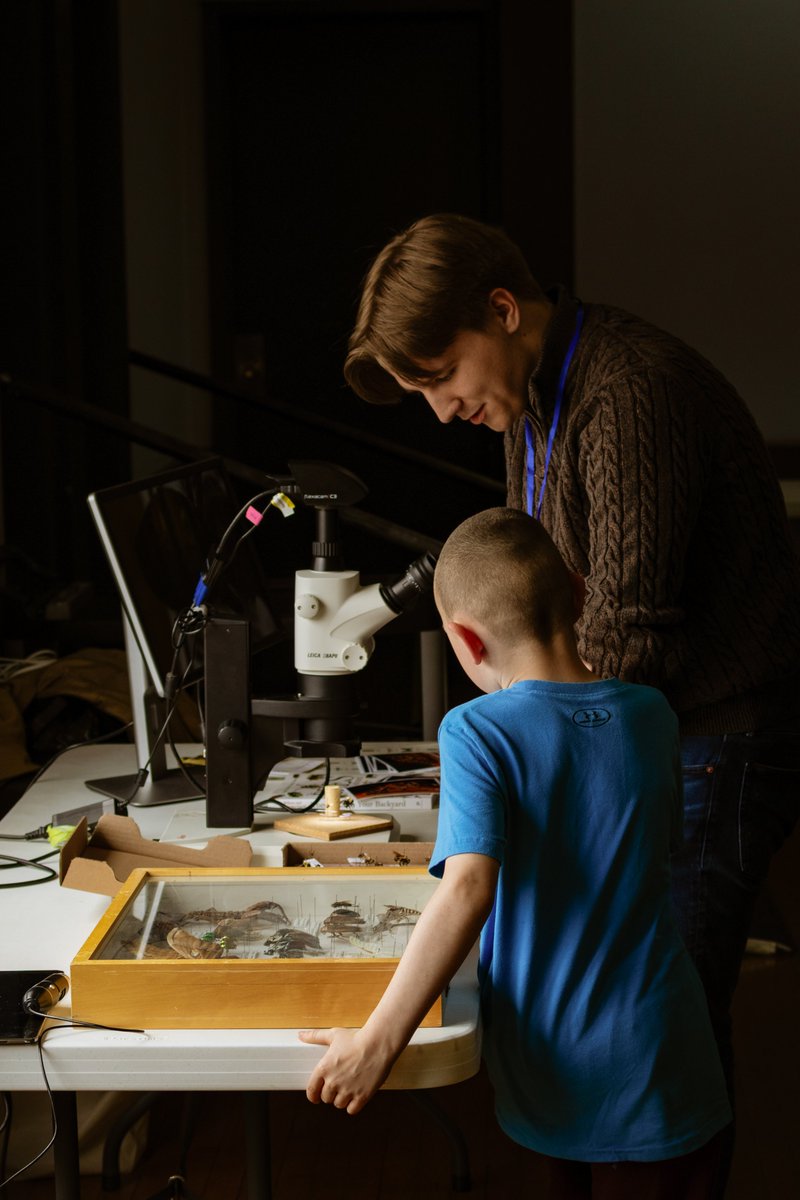 Department of Biology, Memorial University of Newfoundland student Matthew Gover showing a child a closeup look at some insects at the NLBKA meeting this past weekend. Photo Credit: Dr. Tom Chapman
