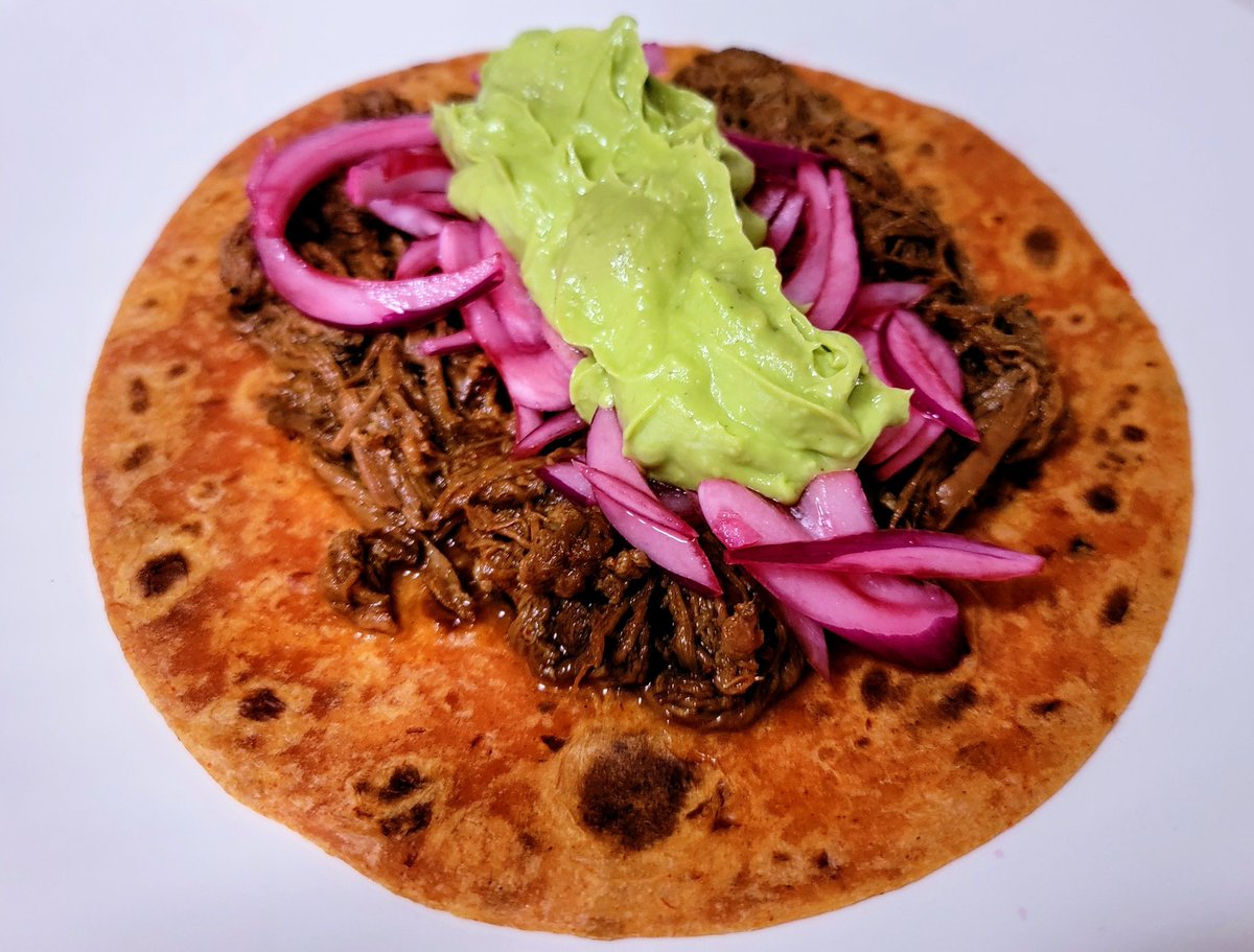 Barbacoa yesterday. Everything handmade: chipotle chile flour tortilla, sweet jamaica pickled onions, guacamole