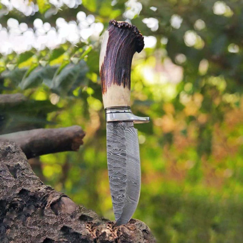 Handmade Damascus Hunting Knife
Crafted with a Razor-Sharp Damascus Steel Blade and a Genuine Stag Antler Handle — a perfect blend of beauty and strength.
Paired with a Hand-Stitched Leather Sheath for timeless rugged style.

Built for the wild. Made to be yours.
DM to Order!