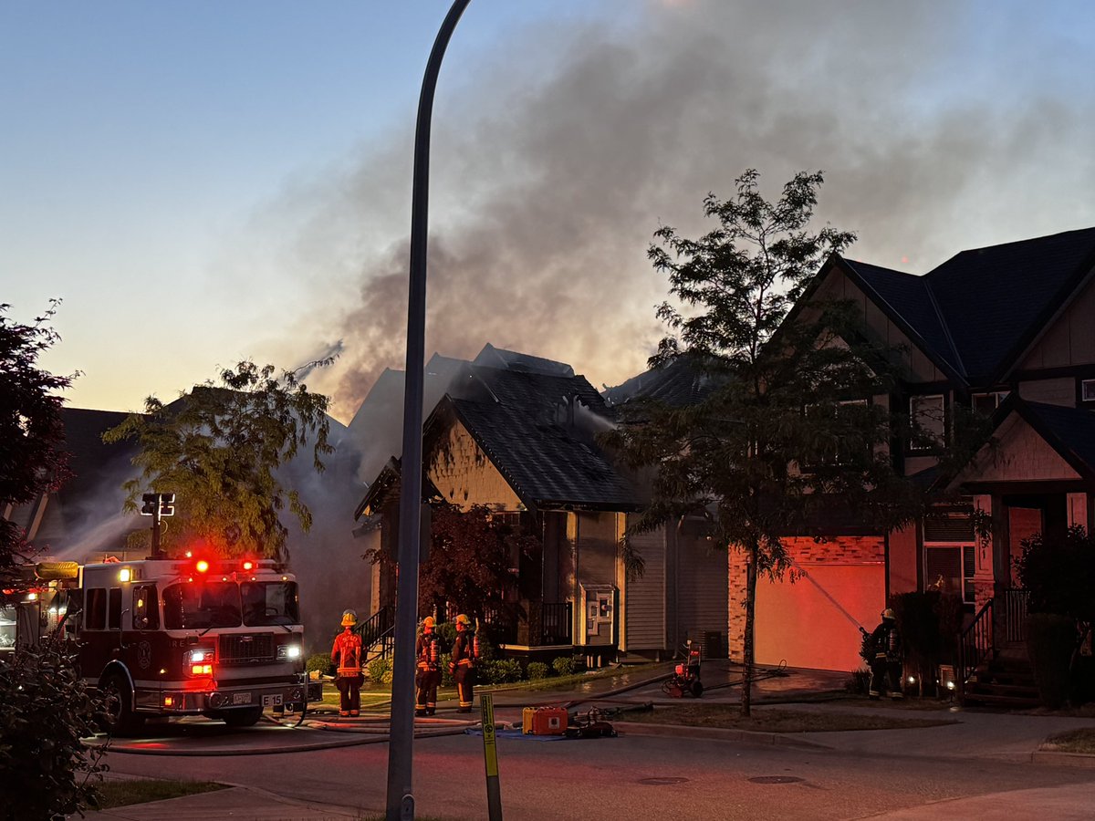 Breaking: Neighbours say a house fire on 66A Avenue near 180 Street in #Cloverdale #SurreyBC may have started with an EV. One home heavily damaged, others with smoke and water damage!
