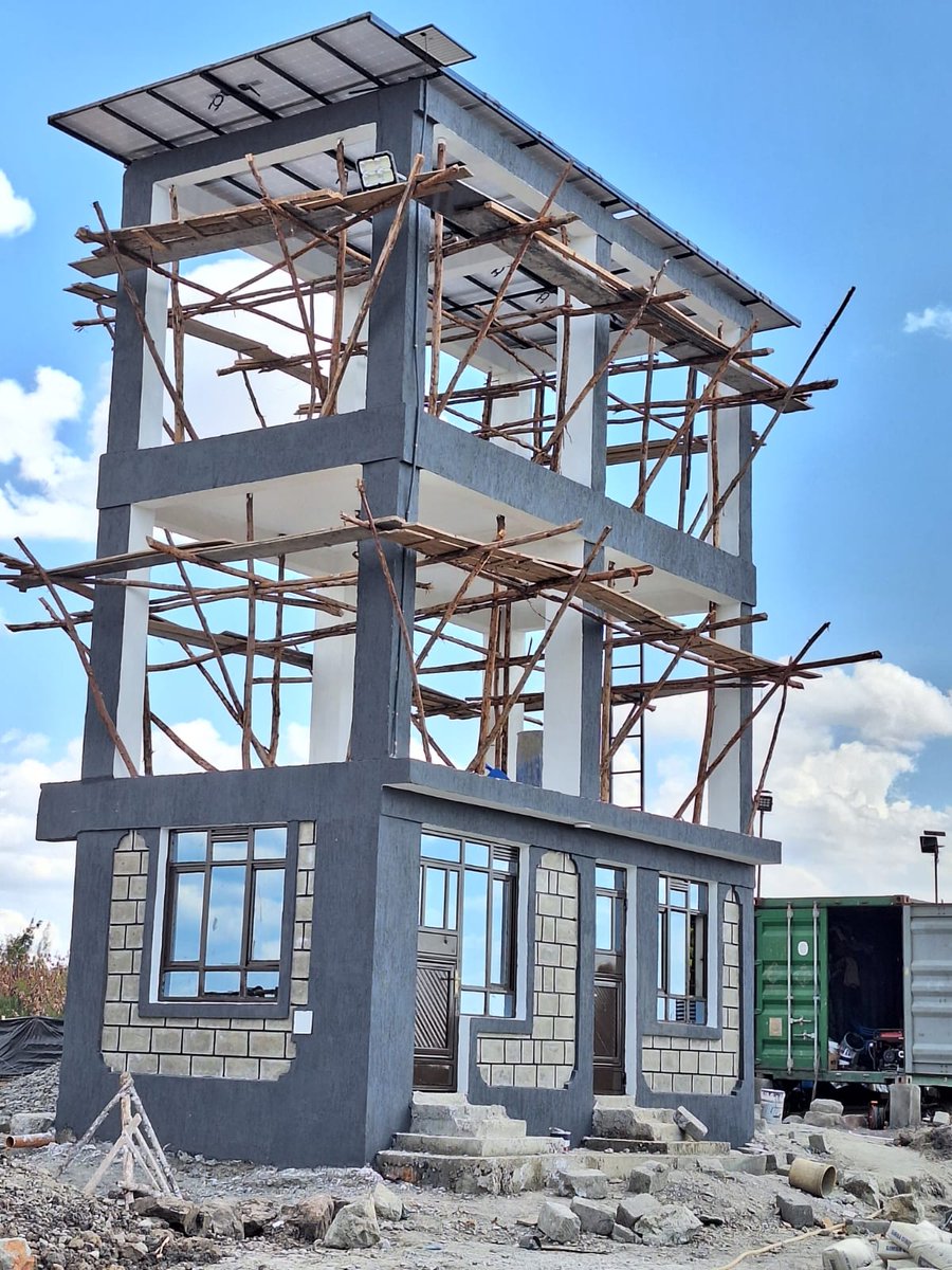 Water tower designed and implemented by yours Truly 
Holds 4 10,000L tanks 
Top roof holds solar panels which once charged power the pump (Sustainable green energy)