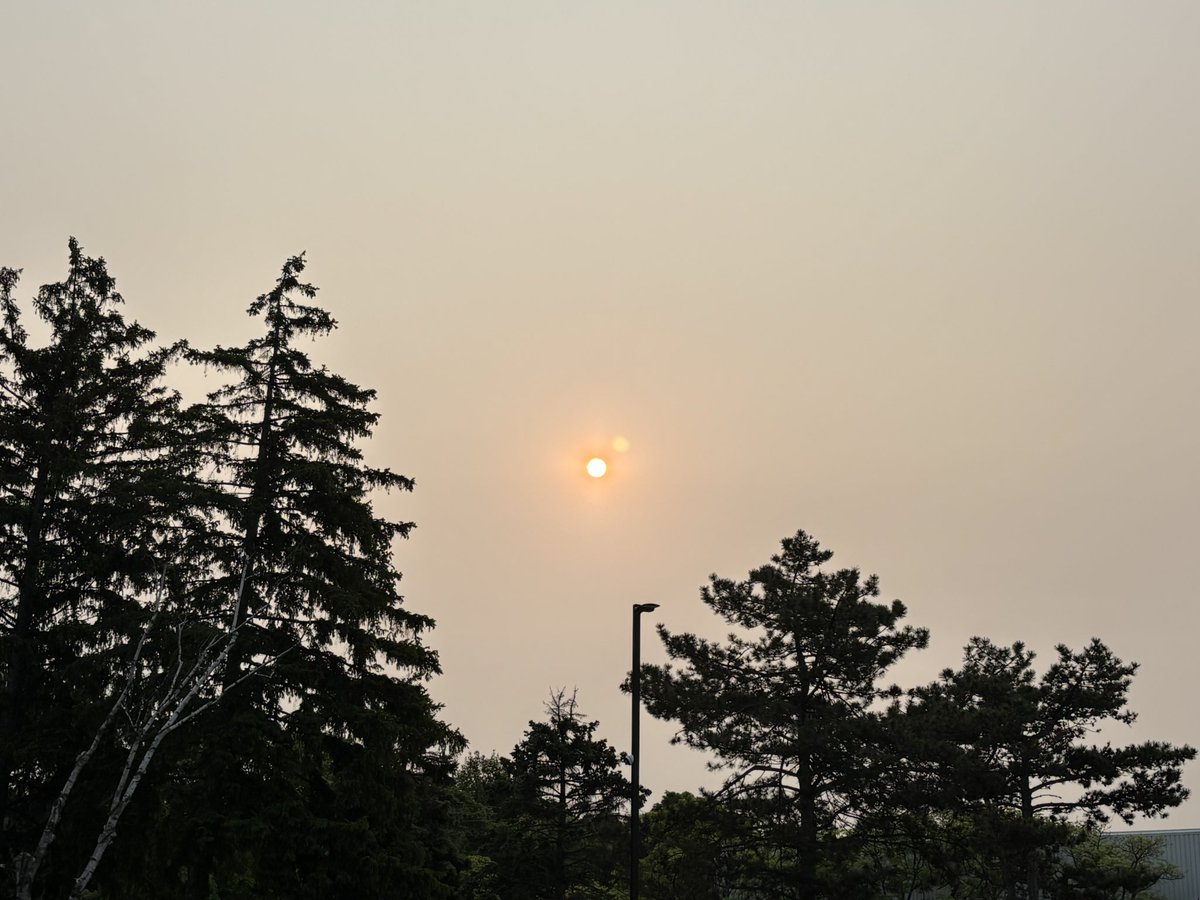 Upper level smoke particles scattering sunlight this morning giving the sun that orange hue. Not a significant impact on air quality so far.