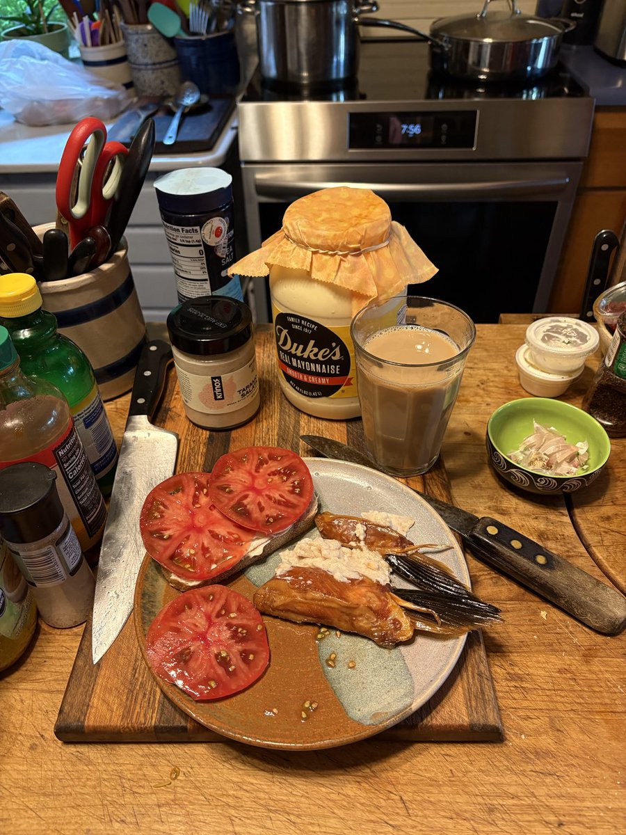 Breakfast of tomato sandwich, smoked salmon fins, and taromosalata. Like going to Waffle House and getting the hash browns all the ways.