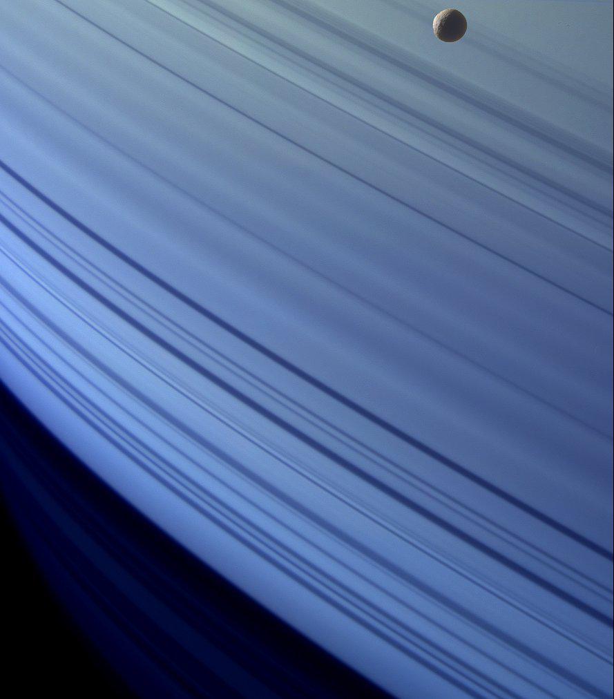 Mimas Glides Along Saturn’s Rings
Saturn’s small moon Mimas appears to skim the gas giant’s massive ring system like a cosmic pebble on a highway. This stunning image was captured in 2008 by NASA’s Cassini spacecraft during its deep-space mission around Saturn.

Source: NASA /