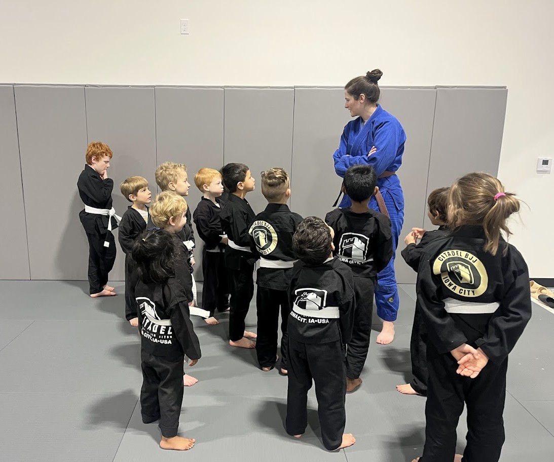 CitadelBJJ's tweet photo. Coach Claire helping our 4–6 year olds build listening skills and respect at Citadel BJJ Iowa City.

With 6 coaches on the mat, every child gets the attention they need to grow.

📅Every Tuesday &amp; Thursday, 5:00–5:30 PM

Confidence, discipline, and fun—spots are filling fast https://t.co/yhXNUnBOaH
