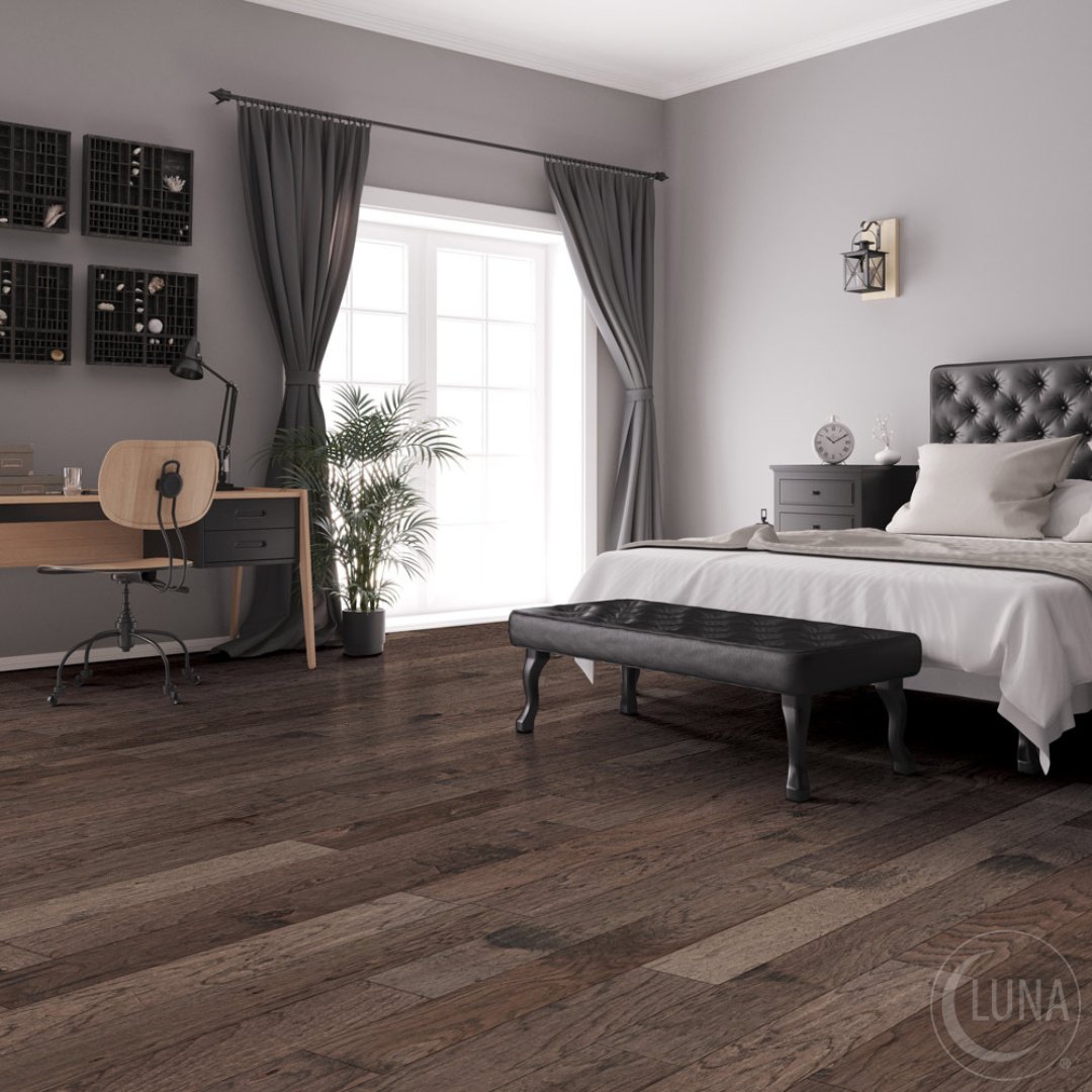 Warm, inviting, and effortlessly elegant, this bedroom features Clarendon Hills' hand-scraped Hickory hardwood, blending natural beauty with lasting durability for a space that feels like home. bit.ly/452jxbl #LunaFlooring #HardwoodFloors
