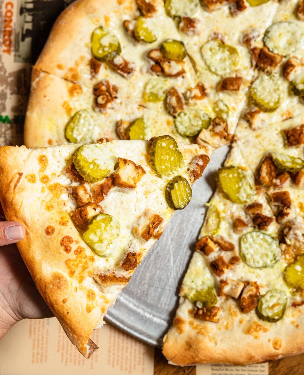 Your favorite is back, and it’s bringing the heat. 🔥🤠 Our Nashville Hot Chicken pizza is a ranch base, mozzarella, diced chicken fingers tossed in Nashville hot sauce, and bread &amp; butter pickles.
⁠
By the slice, or go all in with a 12" or 16" — available all month long.