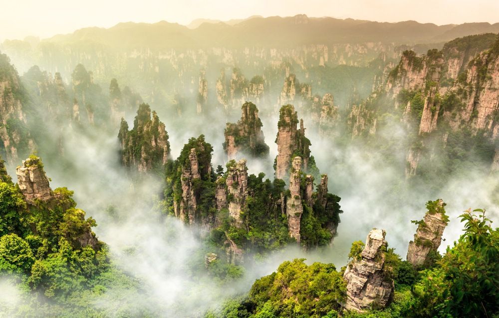 #Zhangjiajie National Forest Park in #China is home to over 3,000 vertical sandstone pillars, some reaching over 200 metres high. It was China's first UNESCO World Heritage-listed forest park, and a surreal masterpiece of nature.  #UNESCOWorldHeritage