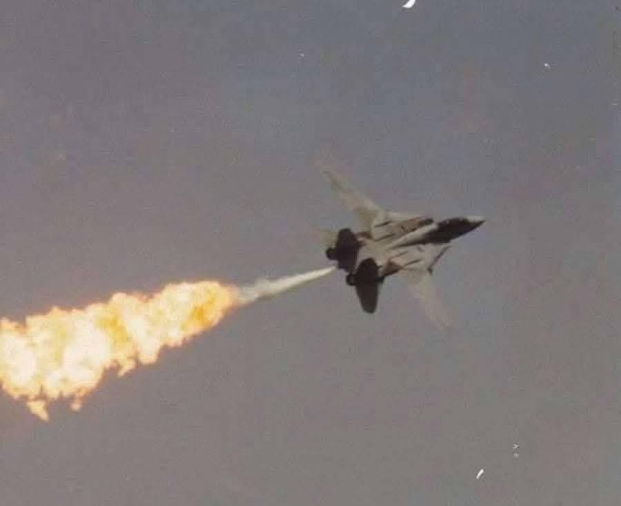 something you don't see everyday! A United States Navy F-14A Tomcat performing an absolutely prohibited, and most spectacular "Dump and Burn!"
   credit: Penny Benjamin