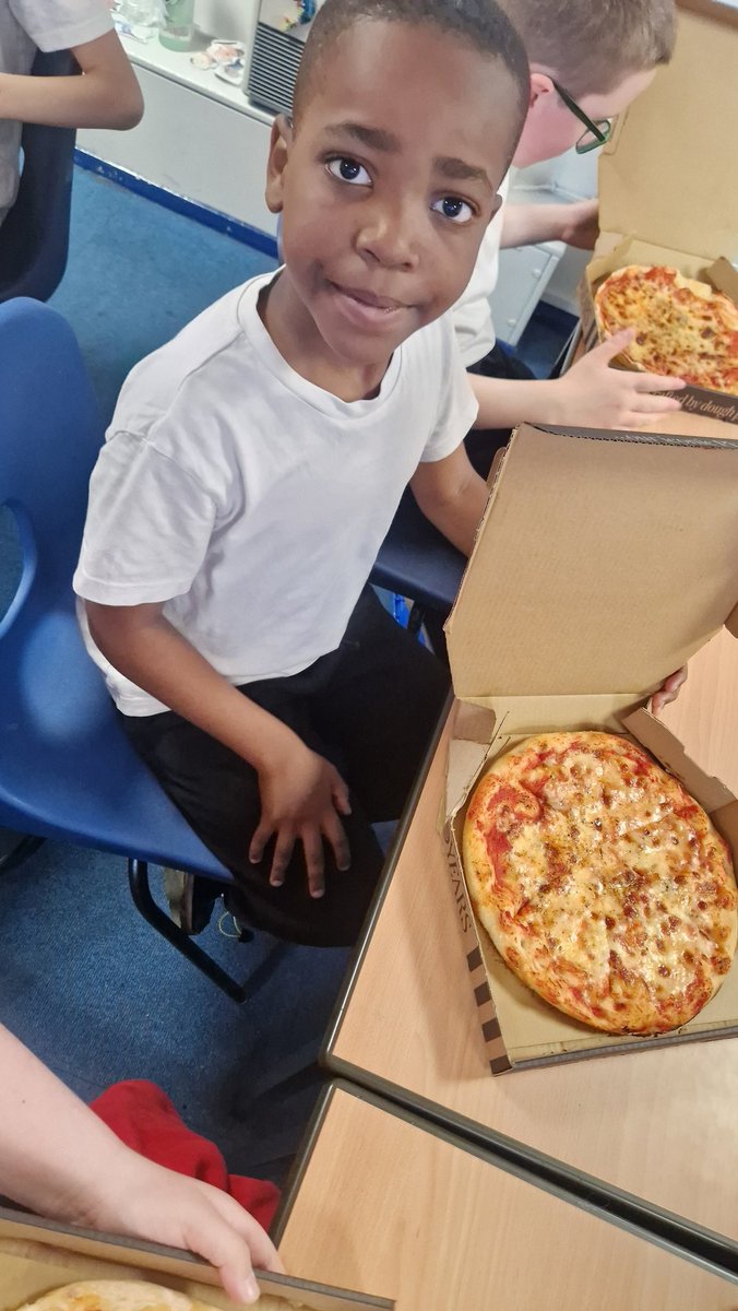 When we got back to school, we couldn't resist tasting a slice of our pizzas! They were delicious and perfect to fuel us for swimming later! The rest of the pizzas are coming home today!