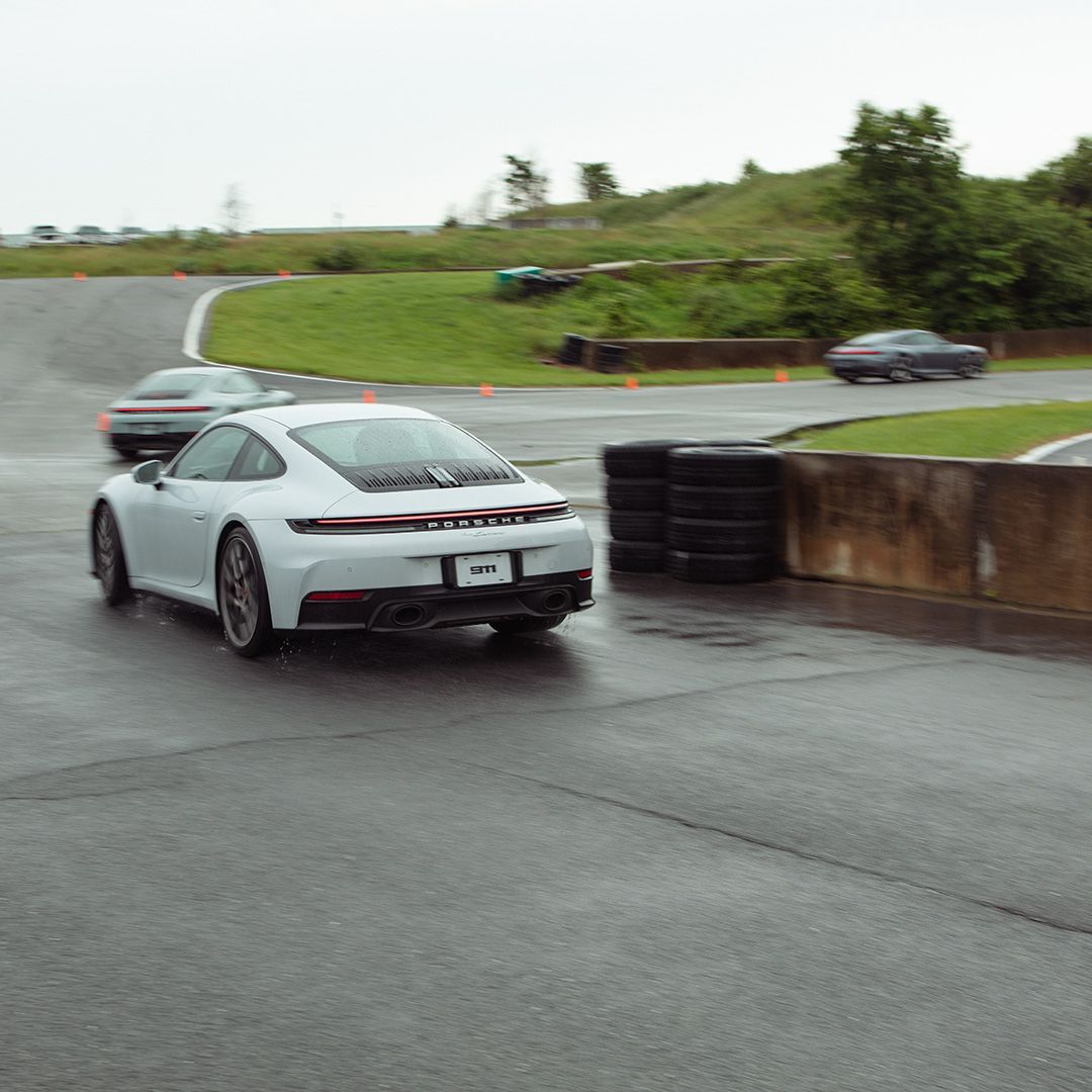 ArlPorsche's tweet photo. A little rain, a lot of adrenaline. Our Porsche Arlington clients took to the Summit Point track for a thrilling, wet-weather drive experience. Guests praised the performance of the 911 in Wet Mode. Check out the full event album now on our Facebook page. #summitpoint https://t.co/SumpMQTree