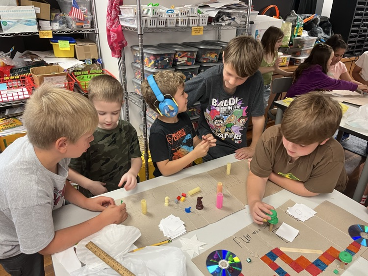Today in STEAM, Miss Altenburger’s 1st graders visited Mr. Burger’s 3rd graders to play the educational board games they invented!
The 3rd graders designed these games especially for y5s, kindergarteners, and 1st graders.  It was a blast watching their creativity come to life!