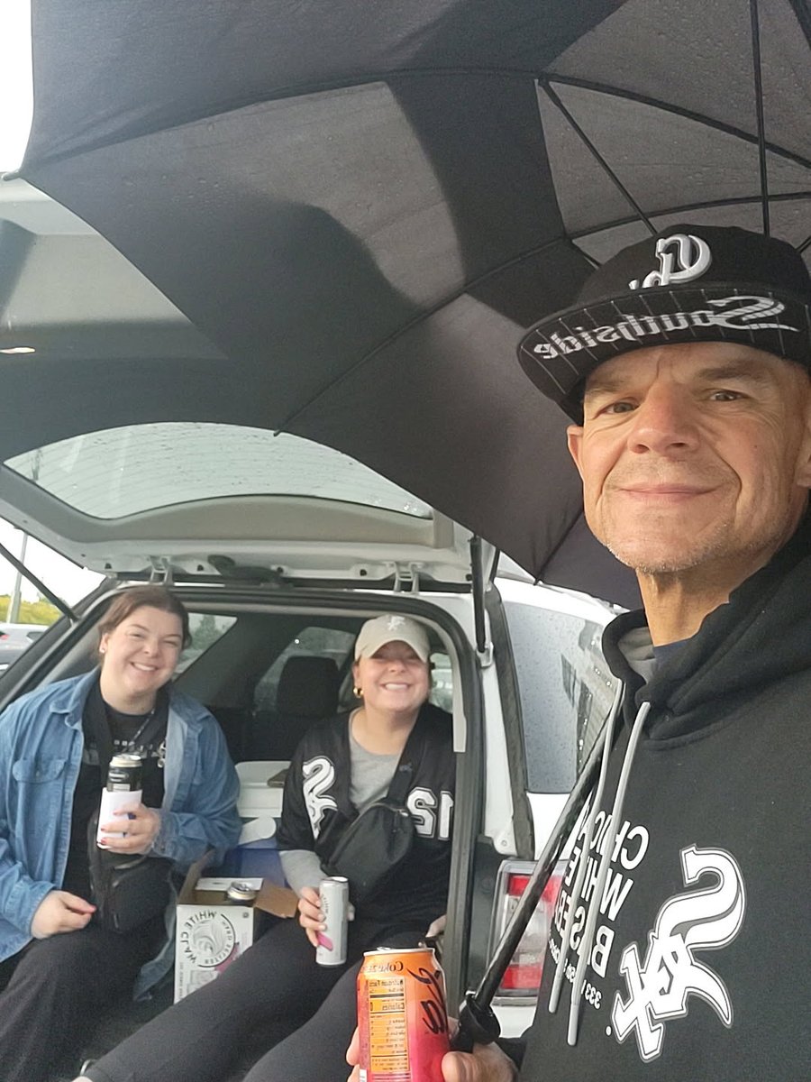Lil Rain delay.  Seems like Mom is giving the girls time for more tailgating.