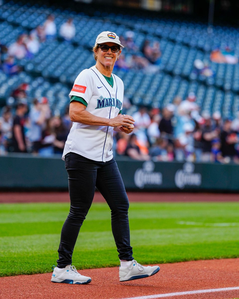 Mariners's tweet photo. Tonight's first pitch, thrown by @SeattleStorm co-owner Ginny Gilder, begins a new baseball tradition. 

This one-of-a-kind Pride Ball will travel to ballparks across the country for Pride events all June long, as we join teams across @MLB in celebrating the ways baseball brings communities together.
