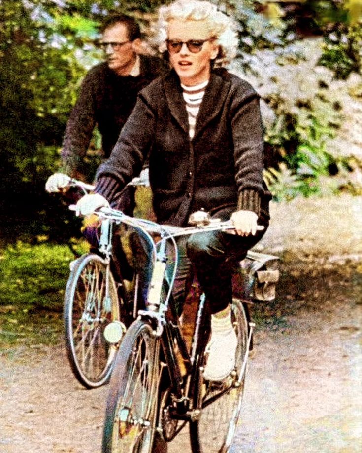 Marilyn and Arthur Miller cycling while in London 1957