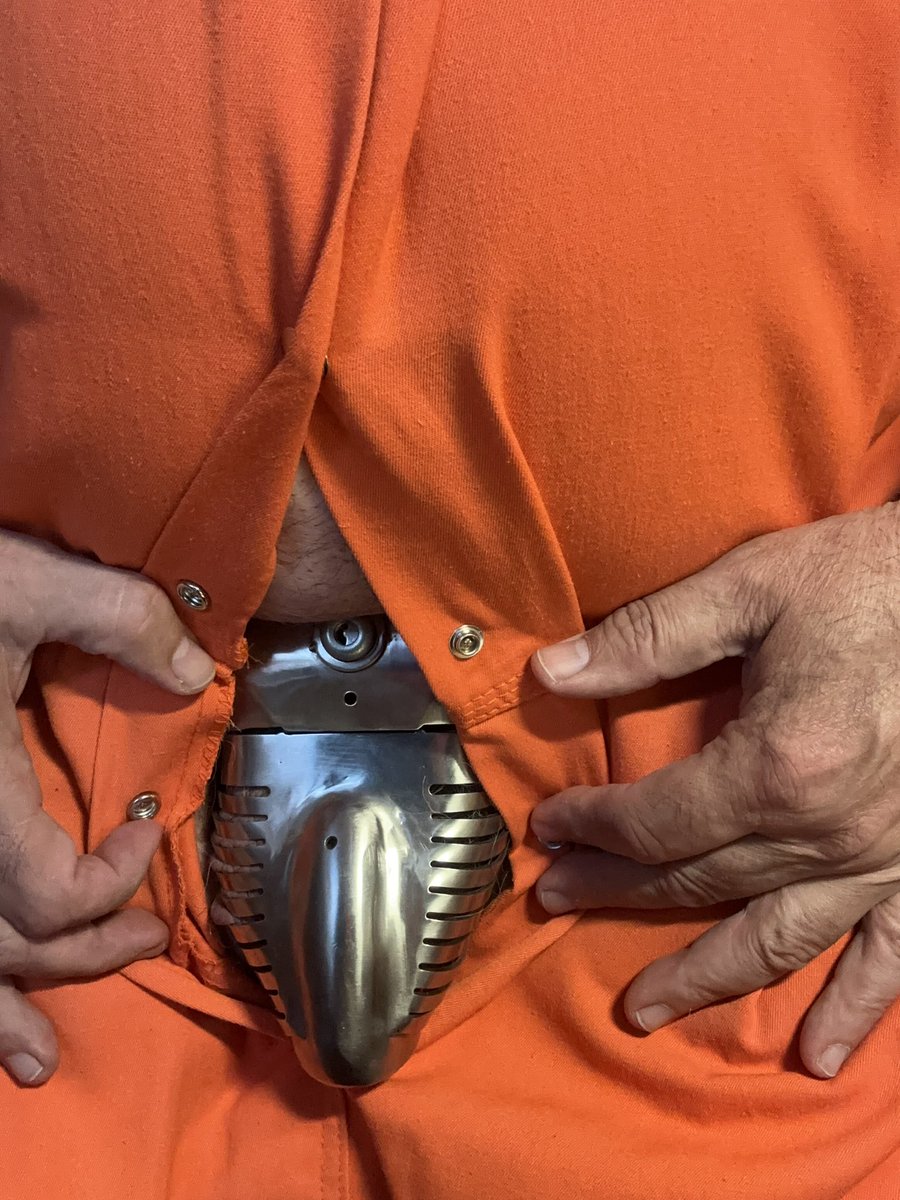 An orange jumpsuit, “Detention Center” stamped bold on the back.
The buttons slightly parted—just enough to glimpse the cold gleam of a #Carrara #chastity belt beneath.
Some prisons are made of steel. Others, of rules you never chose.