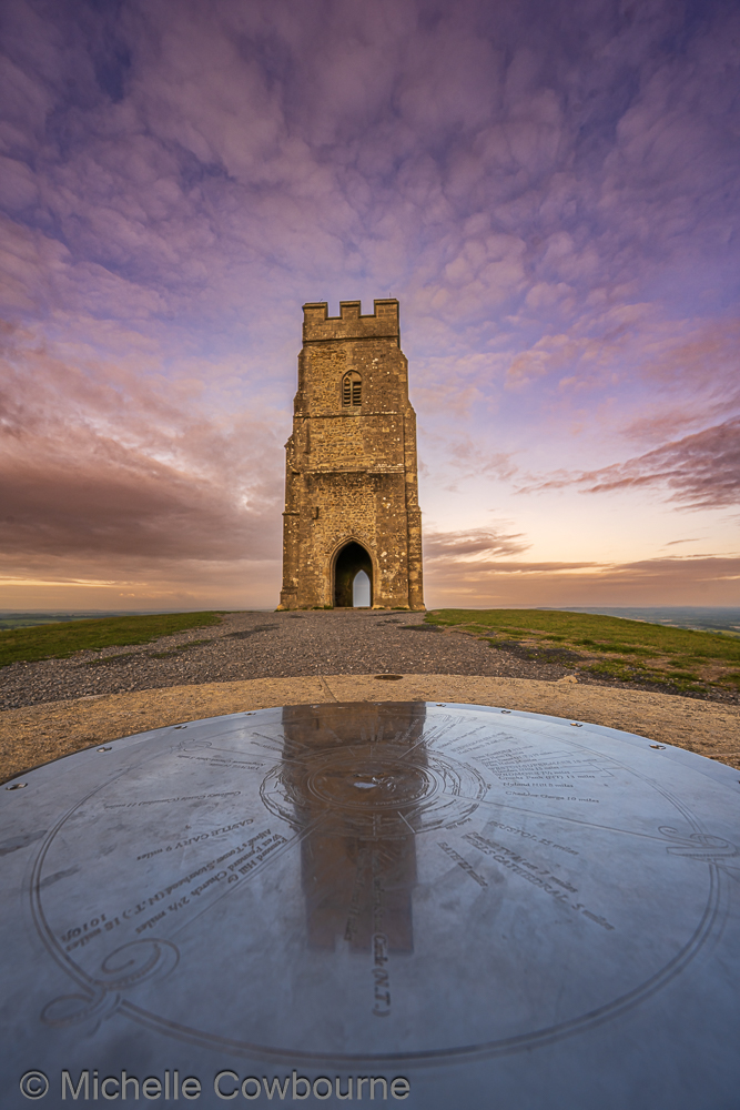 Compass stone and reflections. Taken on Glastonbury Tor.