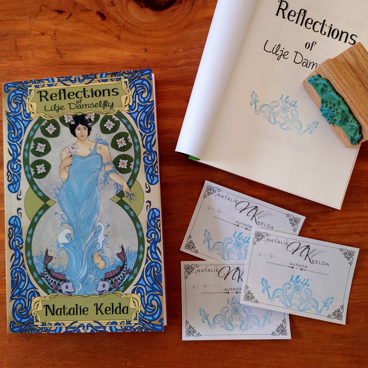 New stamp! What do you think of the design?

For bookplates and paperbacks bought directly through my site, I now have my Lilje Damselfly author stamp*. I drew it the other evening. This stamp+colour is unique to Reflections of Lilje Damselfly.

L!nk below for pre-orders!