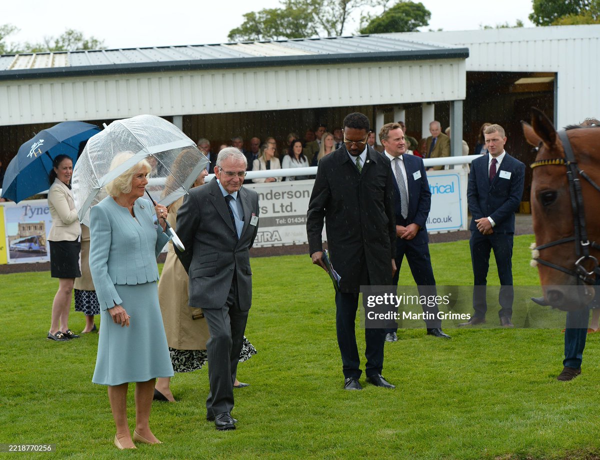 The Queen is led across the parade ring by Racecourse Manager Robert Whitelock as she visits Hexham Racecourse to open the new "Queen Camilla Stand"🥰
