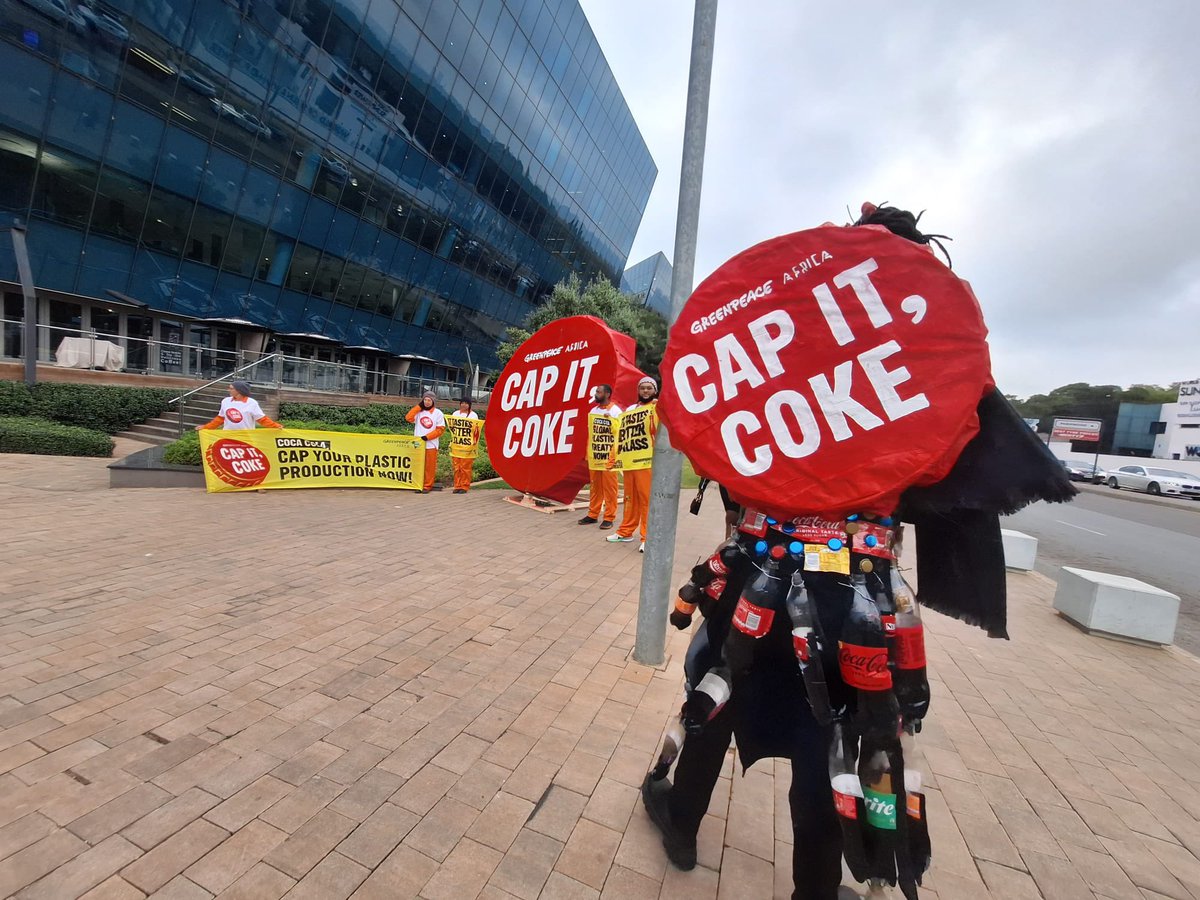 HellenDena's tweet photo. Coca-Cola is the number 1 plastic polluter globally producing 120 billion throwaway plastic bottles a year, that is why @Greenpeaceafric activists staged a protest outside their corporate offices in Johannesburg #BeatPlasticPollution #WorldEnvironmentDay2025 https://t.co/AaT3TFua3D
