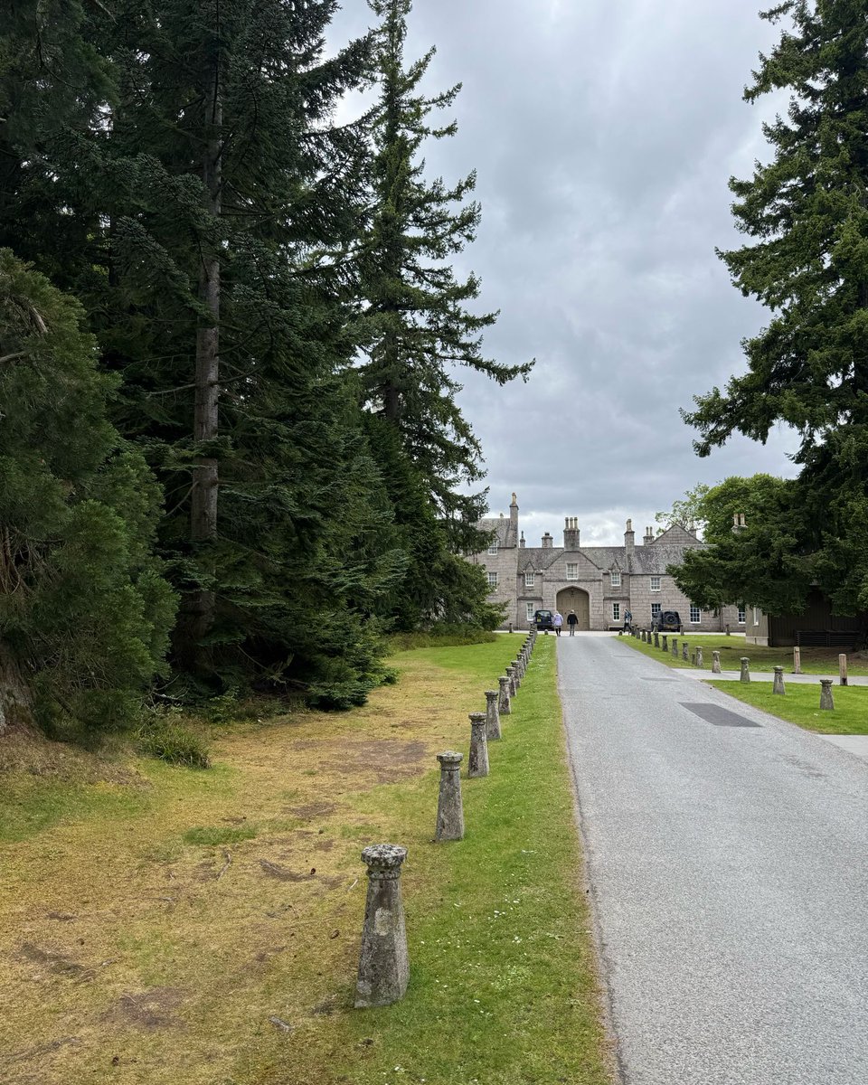Balmoral Castle is a breathtaking sight, framed by majestic, towering trees that whisper the secrets of centuries past. Their sprawling branches create a stunning contrast against the castle's architecture, inviting visitors to stroll through the serene grounds. #BalmoralCastle