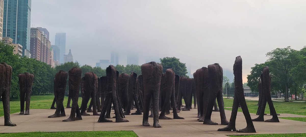 Topless buildings behind headless statues. Story at 10.