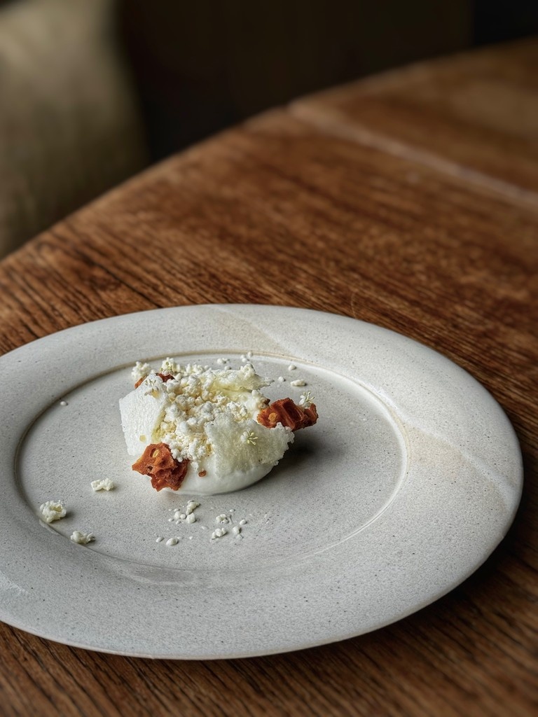 BlkSwanOldstead's tweet photo. Welcoming elderflower season with a refreshing new pre-dessert. An elderflower sorbet topped with burnt elderflower honeycomb, dehydrated aerated milk, bee pollen, condensed milk jam, and fresh elderflower. Finished table side with elderflower honey and elderflower granita. https://t.co/VbGsnTlFwM
