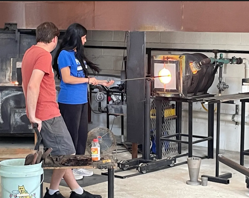 Community Connections to build a beautiful neighborhood.  Students from fine and performing arts classes participated in glass blowing workshops at McFadden Glass Studio!