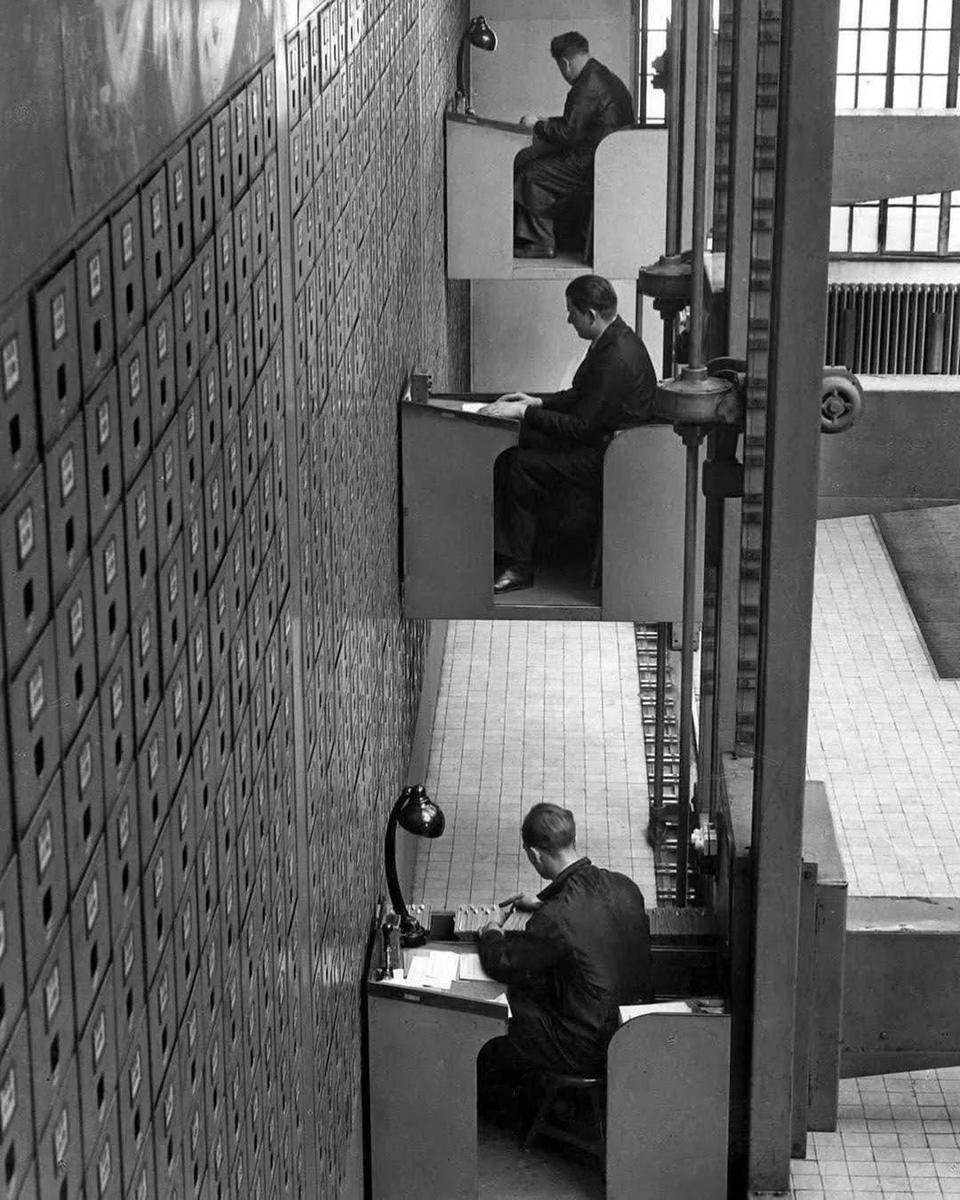 File clerks working in electric elevator desks.

Prague, Czechoslovakia, 1937.