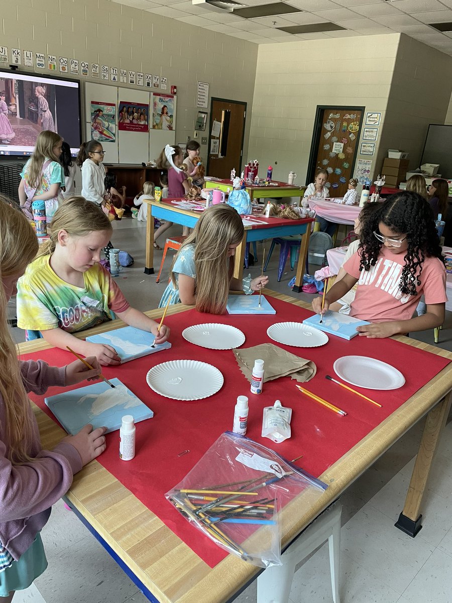 TaylorKuhn98's tweet photo. All Across America with The American Girls- Day 1 students learned about Pioneer Days with Kirsten in 1854 and the turn of the century in 1904 with Samantha! We made butter and paper dolls! We also began our canvas painting! We learned about quilt making &amp; designed one! https://t.co/pMGuHMtoWm