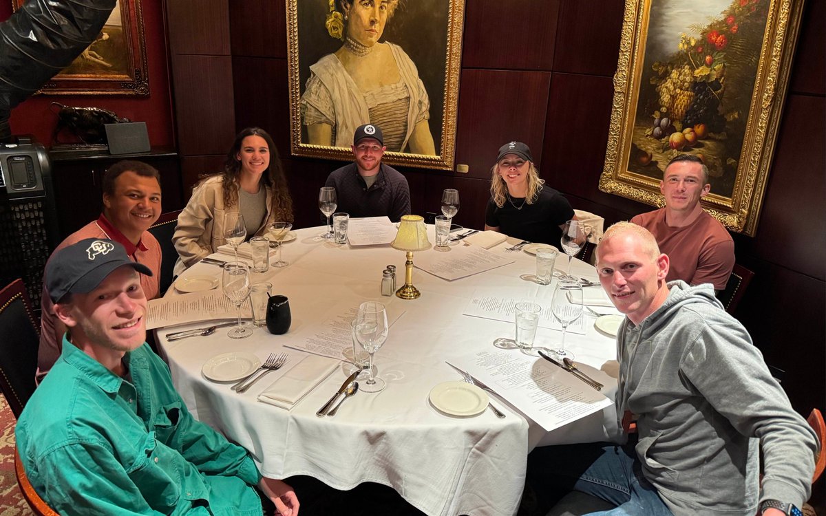 Group dining at The Capital Grille, a classy American restaurant in Denver known for dry-aged steaks and fine wines.