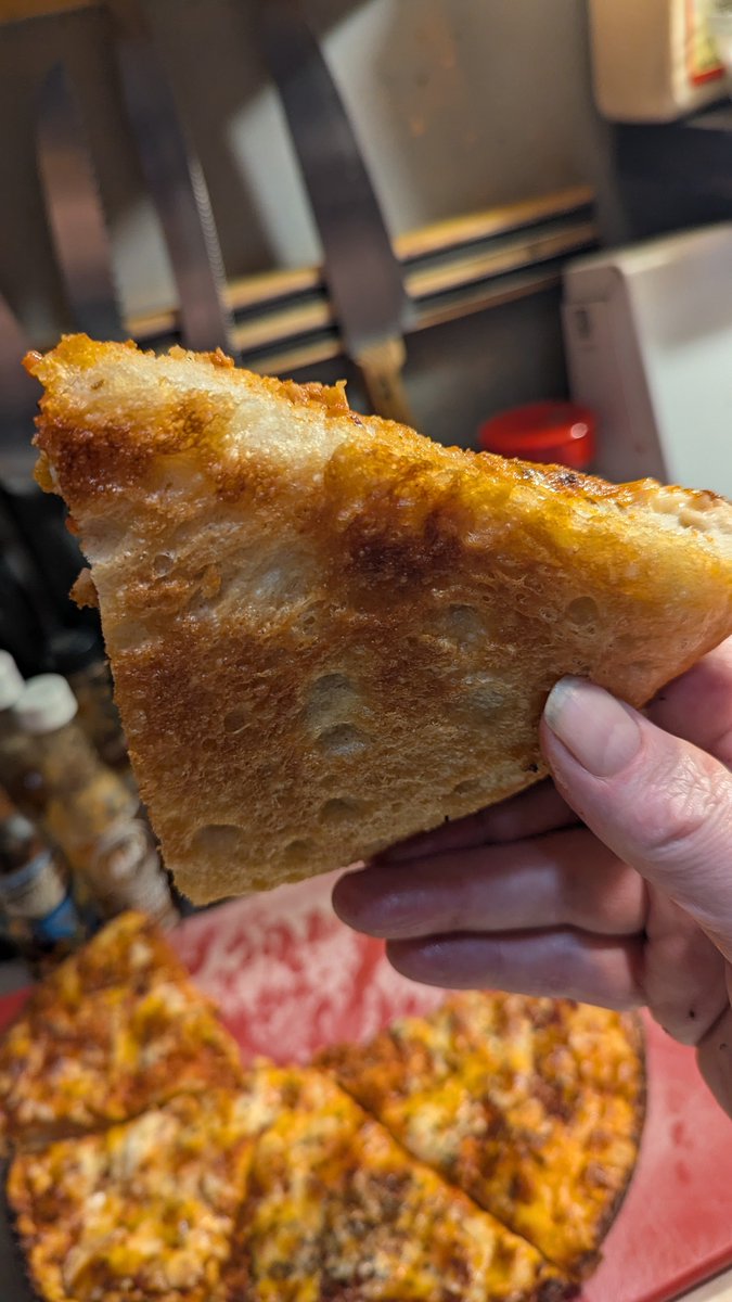 Just a three cheese pan pizza in a 70 year old cast iron skillet