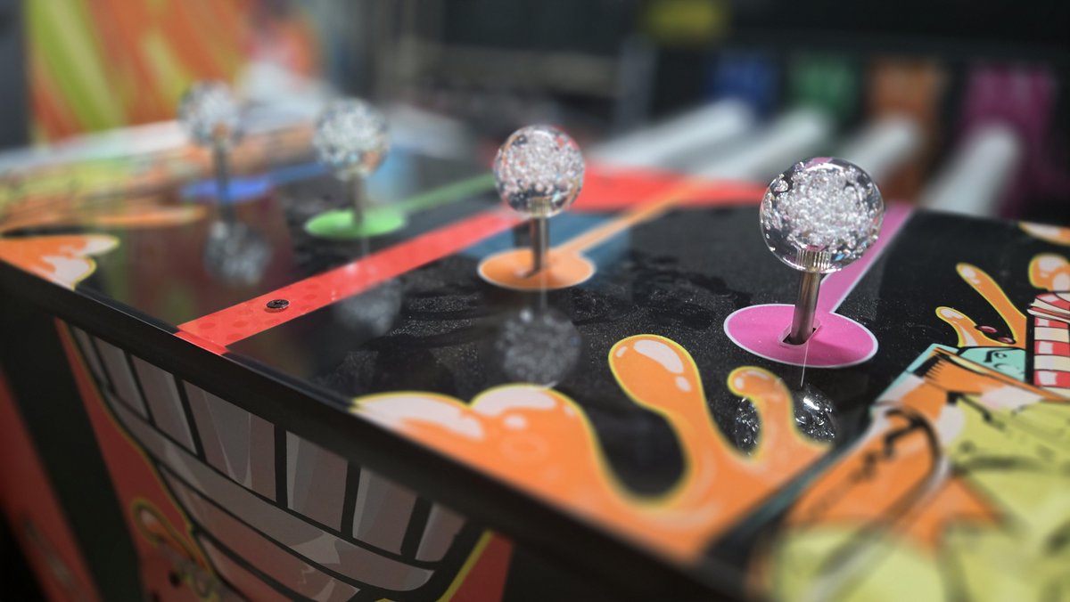 We have made a change to Soda Slam's controls that results in better reliability, while maintaining the same functionality. 

Soda Slam is shipping out now to an arcade near you!