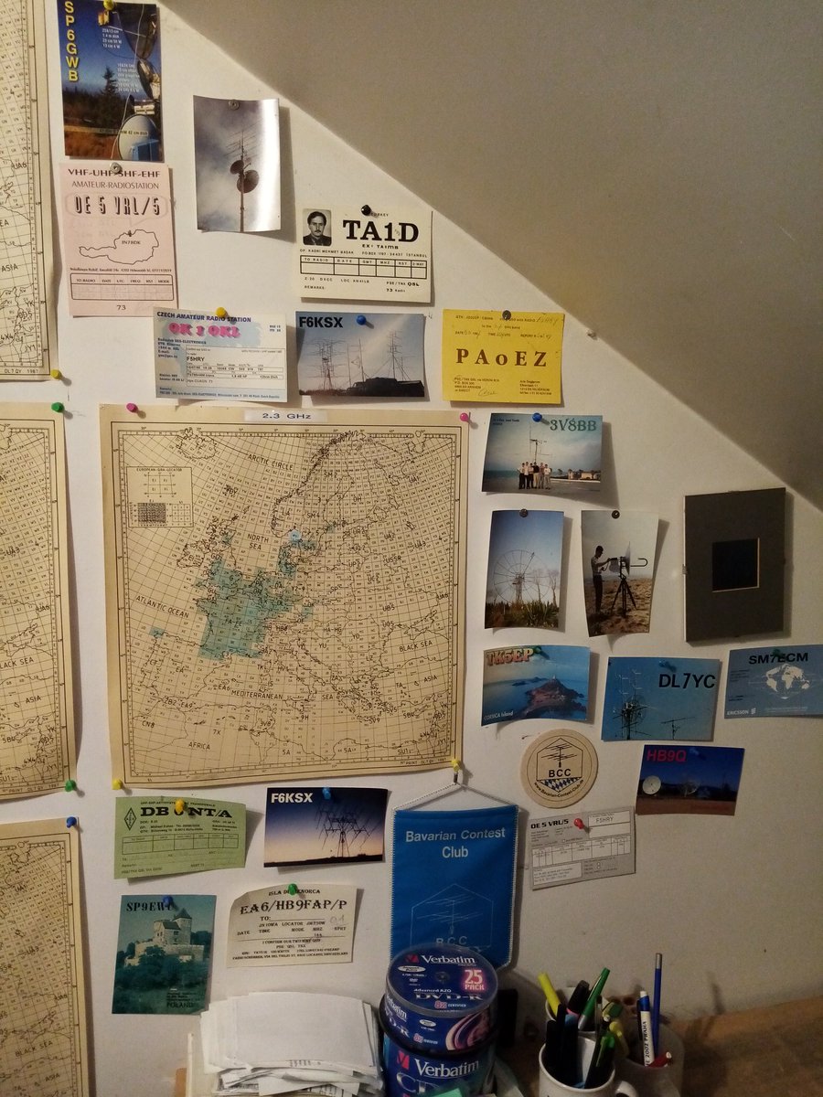 Moving in 3 monthes. Some QSL and pics on the wall of my 33 years old shack !