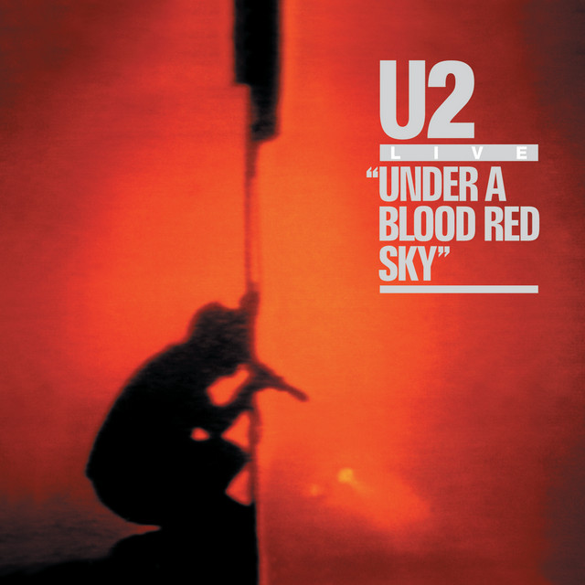 On this day in 1983, U2 played a rain-soaked, fire-lit show at Red Rocks—and made history. The performance became Live at Red Rocks: Under a Blood Red Sky, turning a foggy Colorado night into a legendary live album and one of rock’s most iconic concert films.
