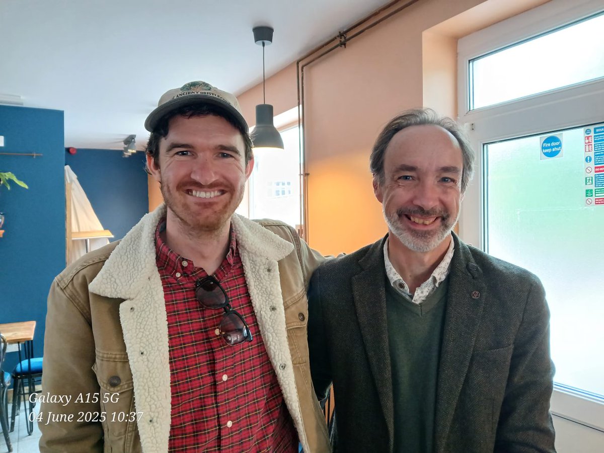 A meeting of Watermark literary titans. But, quick quiz, can you tell which is the American and which is the Brit? There might be a clue in the teeth...