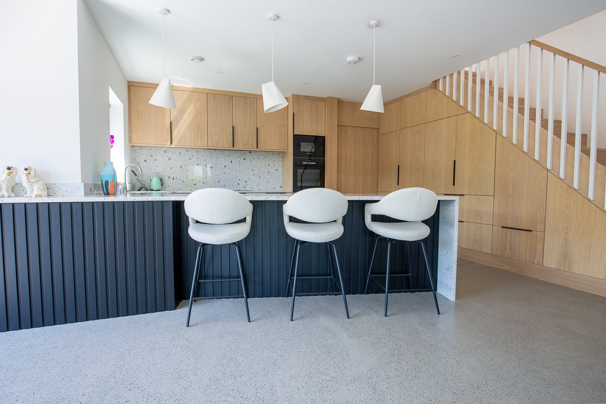 Working with interior architecture and design practice Dubh House Studio, this homeowner set about creating a kitchen featuring a concealed breakfast pantry, a sliding door and hidden storage under the navy peninsula, which is topped with a CRL Quartz Venetian Grande worktop.