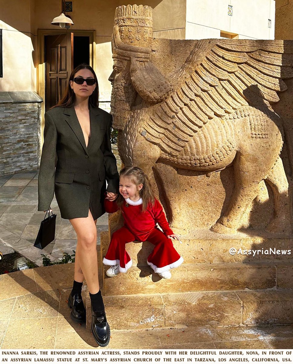 #InannaSarkis, the renowned #Assyrianactress, stands proudly with her delightful daughter, Nova, in front of  an #Assyrian #Lamassu statue at St. Mary's Assyrian Church of the East in #Tarzana, Los Angeles, California, USA.