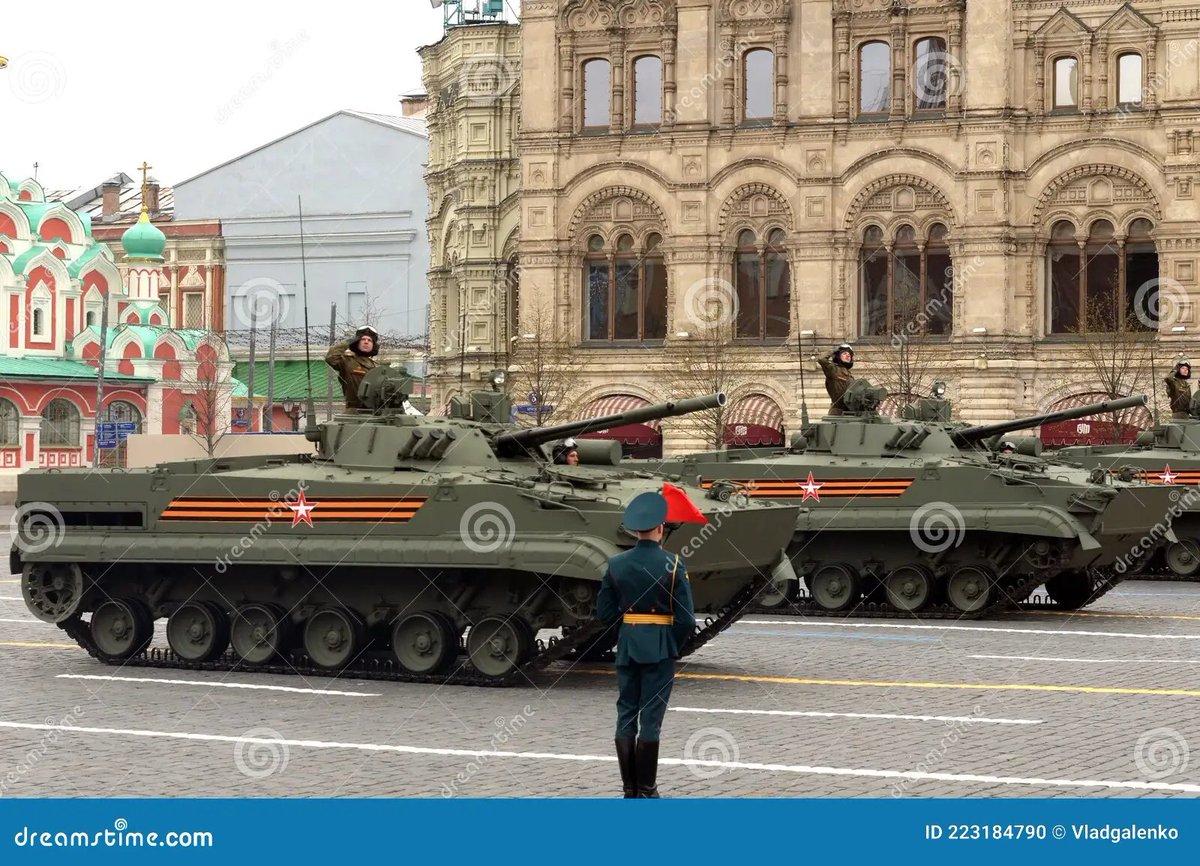 vehicles coing to the parade in DC.. notice anything?  they are the same color as the ones used in the russian parade.. the US nearly NEVER has green vehicles, cammo yes, tan yes... flat green.. nearly never