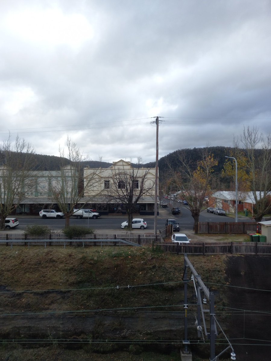 David_J_Harley's tweet image. Some blue sky out the front window, clouds over the mountains out the back. Should warm up in in an hour or two. Trains from Lithgow have been running to time.