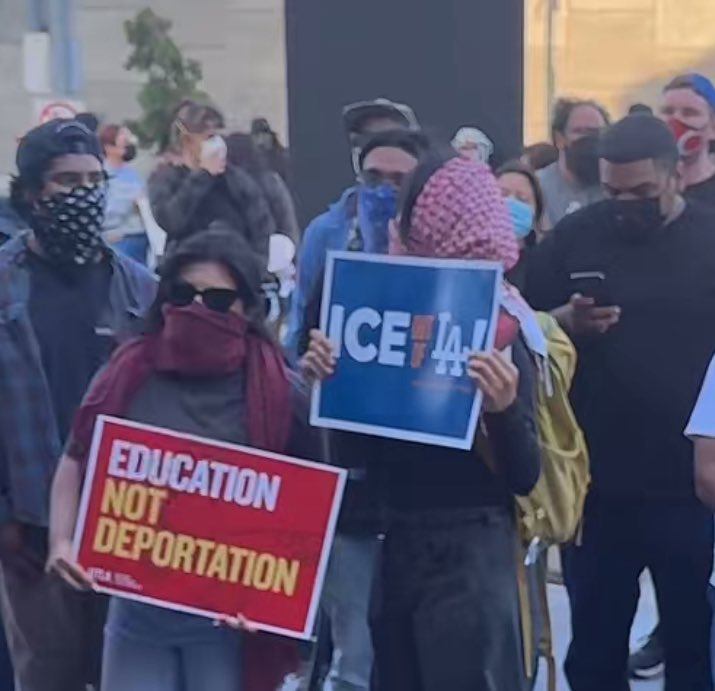 The protestors outside the Federal Detention Center are organized.  Printed signs.  Who is paying for this?