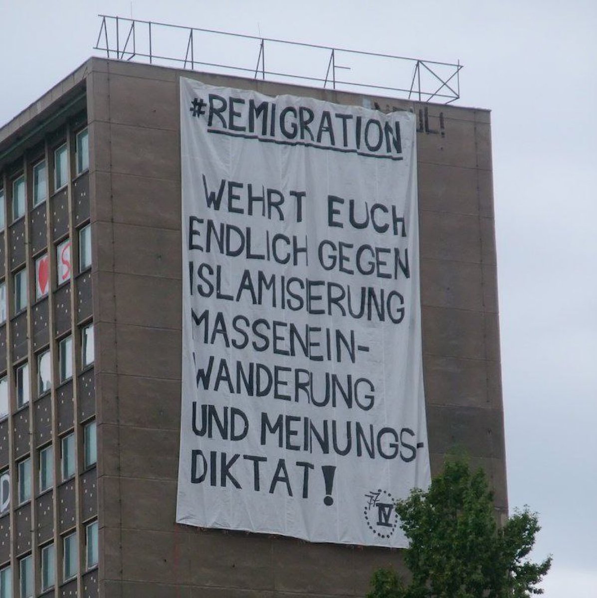 A sign in German: “
"REMIGRATION

DEFEND YOURSELVES FINALLY AGAINST ISLAMIZATION MASS IMMIGRATION, AND OPINION DICTATORSHIP!"