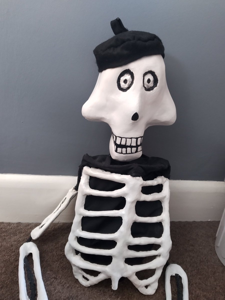 Finished the skeleton puppet, made him a beret. Lol