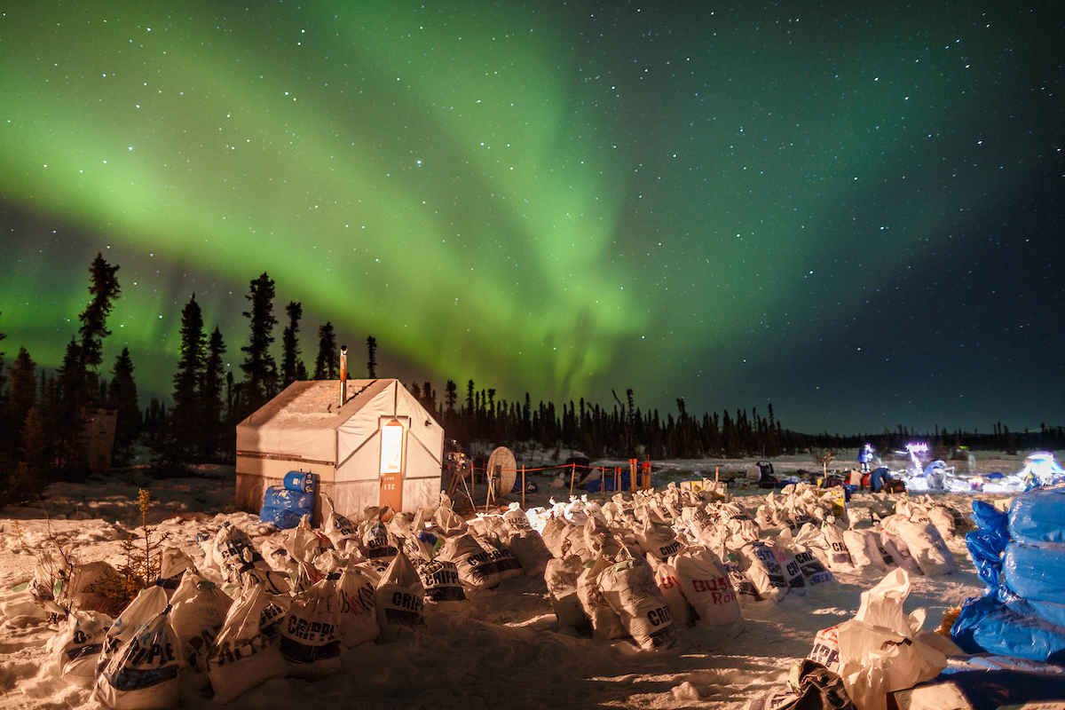 🐾 #Iditarod #ThrowbackThursday 🐾
The Northern lights light up the sky at the Cripple checkpoint on Thursday, March 10th during the 2016 Iditarod.  

📷 @iditarodjeff | schultzphoto.com