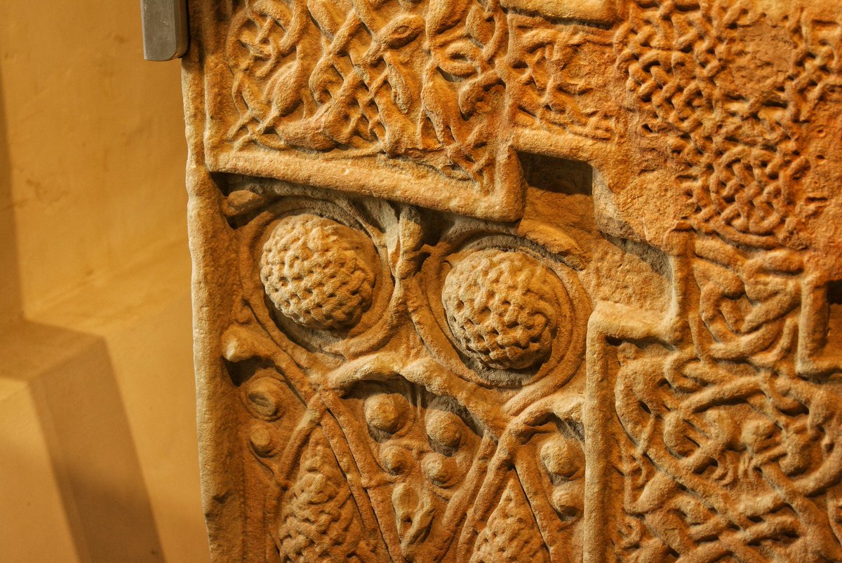 A masterpiece of medieval art from the late eighth century. 

The superlative Pictish cross slab at Nigg. Close up detail of the pediment showing the Desert Fathers taking the Eucharist (note the notch taken out). The third image shows the amazing interlace and snake bosses.