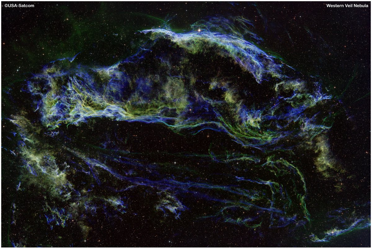 The Western Veil Nebula, also the Witch's Broom Nebula, is a portion of the larger Cygnus Loop supernova remnant located in the constellation Cygnus. It's a cloud of heated and ionized gas and dust, formed from the exploded remains of a massive star that went supernova roughly