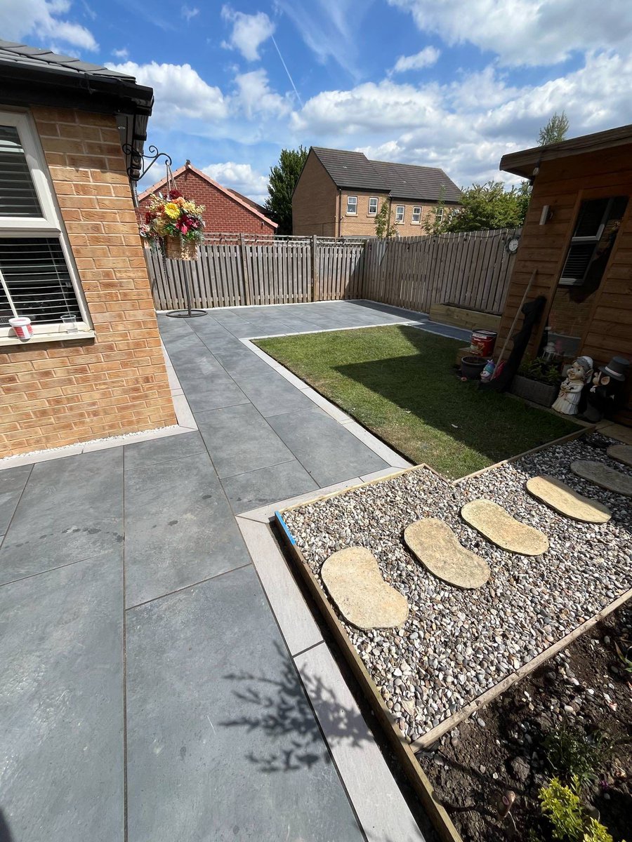 Wow! Just look at this stunning patio transformation by JK Paving &amp; Surfacing. 

They've combined our sleek Storm Anthracite Porcelain 1200x600 with the elegant Grigio Grey Porcelain 900x150. The result? A truly refined patio offering timeless outdoor beauty. ✨

#patio #gargen