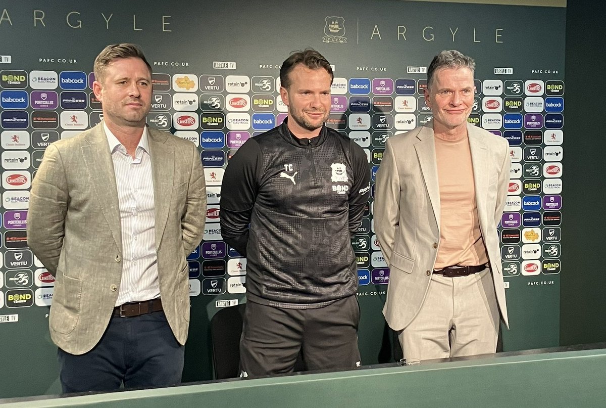 Voodoov21's tweet image. Look very carefully.
Take your time. 
One of these individuals signed off the Hardie and Randell relegation release clauses. 
If you do recognise that person, please notify the officer on your way out.