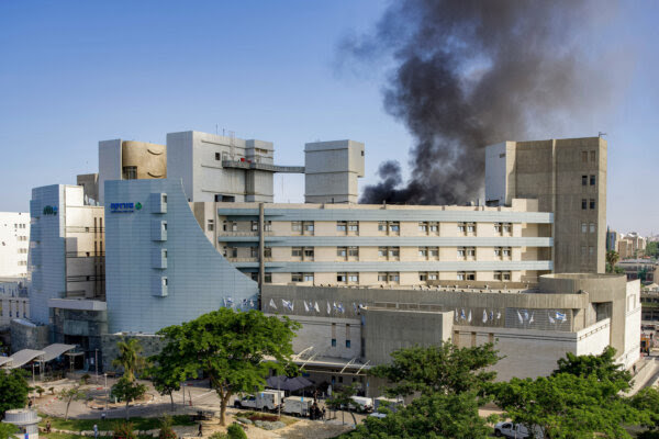 Israel Threatens Iranian Leader Khamenei After Missile Hits Hospital, 
Smoke billows from a building at Soroka Hospital in Beersheba in southern Israel following an Iranian missile attack, on June 19, 2025.